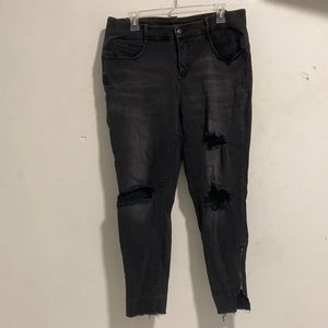 Faded black ripped women’s jeans